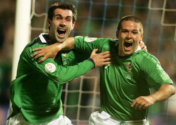 Northern Ireland's David Healy (right) celebrates scoring his first goal of his hat-trick against Spain with Keith Gillespie at Windsor Park.
Picture by Brian Little