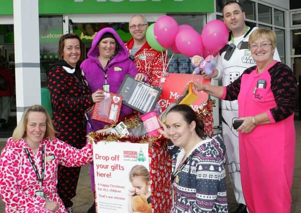 Asda staff Coleraine with Community Life Champion Sheila Palmer launching the Cash 4 Kids charity appeal. INCR48-150PL