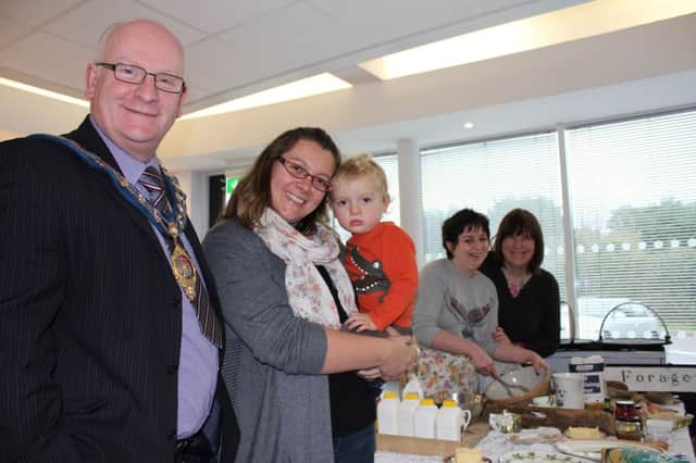 Alderman Billy Ashe with Sarah and Oliver Prince being shown how to make hedgerow jam by Mary Hughes, Forage and Lisa Haggan, Carrickfergus Borough Council, at the recent 'Celebrate the Christmas Hedgerow' event at Eden allotments. INCT 50-709-CON