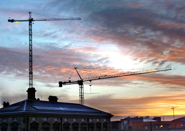 Cranes on the Belfast skyline. West Belfast firm building supplier is seeking the winding up of Eglinton construction firm BM Groundworks.