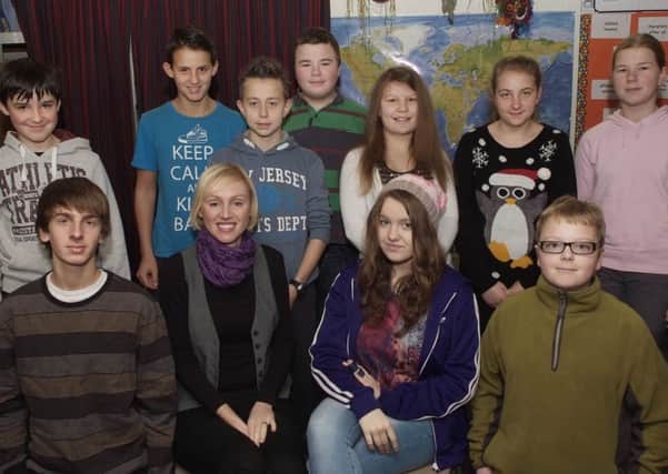 Ewelina O'Donnell (second from left, fron t row) pictured with some of the students at the Polish Saturday School. INLS4913-203KM