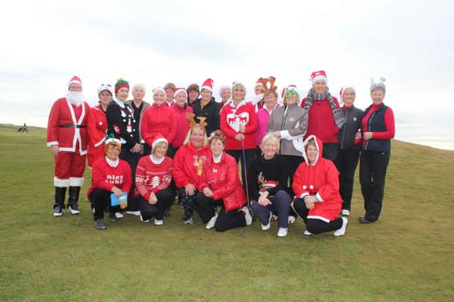 Lady golfers dress up Santa style at Portstewart Golf Club.