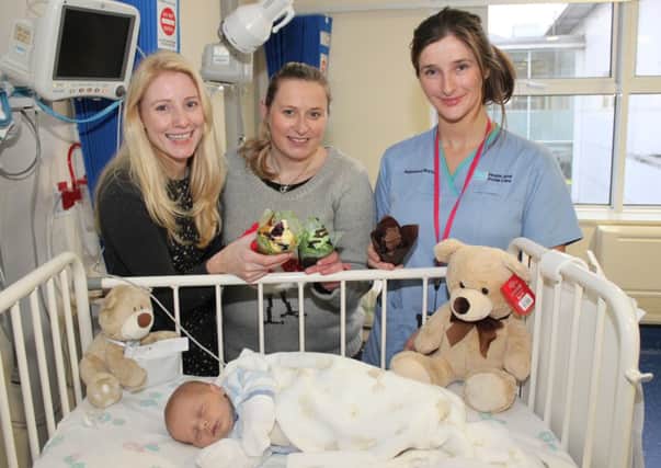 Three week old Brayden Moore from the Waterside who is receiving treatment for a heart condition with (from left) Sarah Quinlan, Executive Officer of the Childrens Heartbeat Trust; Denise Shields, Barista Coffee House; and staff nurse Alison Turner.