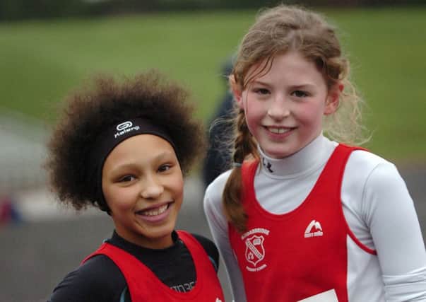 Lily Toorish, left, first place, and Aela Stewart, second place, both from Broadbridge Primary School, take a rest after the girl's race at the Flahavan's Primary School's Cross Country League held in St Columb's Park.