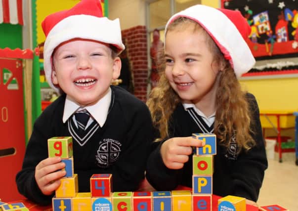 LOCAL SCHOOLCHILDREN HELP LAUNCH CHARITY GIFT CAMPAIGN: Flavia Leoca (4) and Charlie McCartney (4) from St. Colmcille's PS  in Ballymena help launch the Christmas Trocaire Gifts campaign. Last year people in Co. Antrim spent £73,000 on Trocaire's ethical gifts which have helped change the lives of thousands of the world's poorest people. One of the gifts this year is the gift of a school kit for children in Central America which will provide school fees, books, pencils and even milk at lunchtime so that these children can learn and have the chance of a better future. To purchase a gift log on to www.trocaire.org/giftsor call 0800 912 1200. Photo: David O'Hare