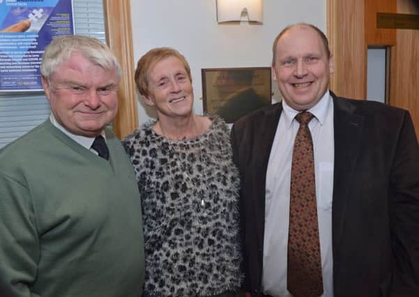 Elma McCalmont is pictured with Councillor Greg McKeen and John Shannon as a plaque is dedicated to Elma on her retirement from Millbrook Community Association after 30 years of dedicated service. INLT 48-016-PSB
