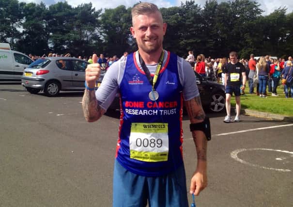 Graeme Philson gives a thumbs up after running the recent Waterside Half Marathon.
