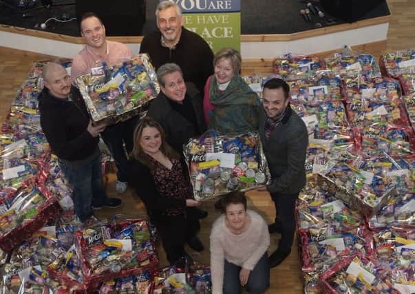 Group pictured at the handover of Christmas food hampers by the congregation of Life Triumphant Church, Fountain Street, for distribution to those in need within the City, from left, back row, Liam McLaughlin, First Housing, Pastor Paul Crawford, and Gerry Burns, Damien House, middle row, Sandra Duffy, First Housing, Liam Milligan, North West Methodist Mission , Rev Louise Donald, Carlisle Road Methodist Church, and Pastor David Cullen, front, Pamela McElhinney, Life Triumphant Church administrator. INLS4913-233KM