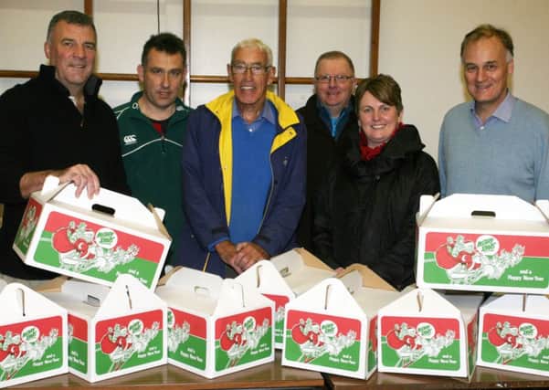 Member of Ballymena Rotary Club with some of the Christmas food hampers. INBT51-253AC