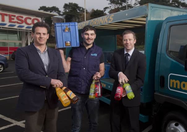 Ballymoney-based Maine Soft Drinks has announced it has secured a deal to supply its soft drinks through Tesco across Northern Ireland.  Pictured are Derrick Harkness, Sales Director, Maine Soft Drinks, Darran Wallace - the modern face of the "Maine Man" and Steven Murphy, Buying Manager, Tesco NI. INBM51-13