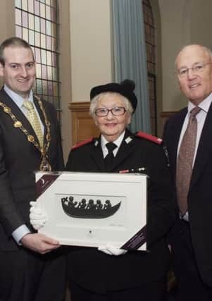 The Mayor, Councillor Martin Reilly pictured making a presentation to Dr. Maureen Howie, Northern Ireland President of St. John Ambulance, who has been made a Dame of the Order of St. John. Included is her husband, Dr. Tom Craig. INLS5113-147KM