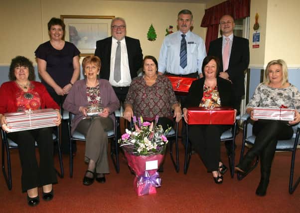 Staff from Craigdun Care Home who received long service awards at a special presentation last week. Included are Patricia Graham (Regional Manager), Jim McCaw (Manger Four Seasons), James Thompson (maintenance), JP Watson (Director of Operations Four Seasons), Mary Johnston (laundrey), Janet Hemprow, Charlotte Marshall (Home Manager), Marion McQuillen (team leader) and Anne Marie Martin (care assistant). INBT51-237AC