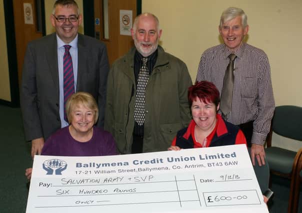 Margaret Dempster of St. Vincent De Paul and Doreen Armstrong of the Salvation Army are pictured receiving a cheque for £600 from Paul Patton (Manager), Pat McCallion (Treasurer) and Francis Scullion (Chairman) of Ballymena Credit Union, a donation for both their Christmas appeals. INBT51-205AC