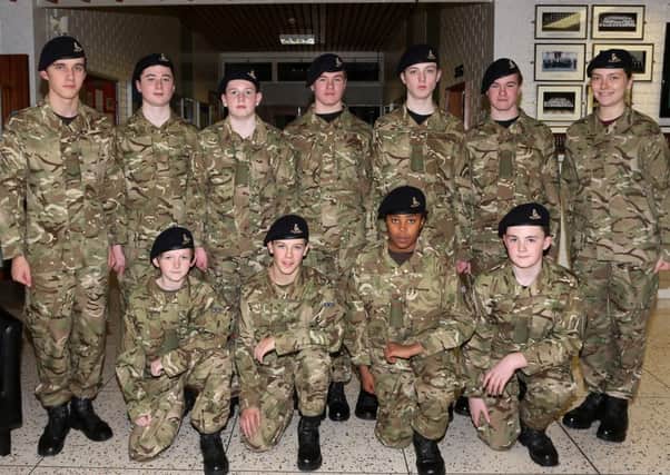 Members of Cambridge House Grammar School Army Cadet Corp drill team at last week's annual inspection. INBT 50-115JC