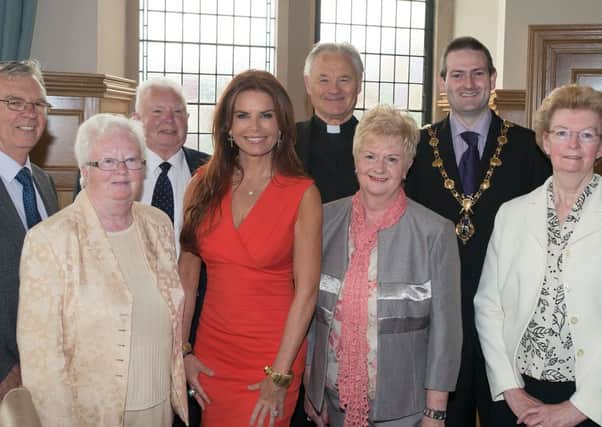 Roma Downey visited Derry during the summer when she was pictured here with Mayor Martin Reilly and from left, John Flood, brother-in-law, Jacinta McLaughlin, sister, Pat Downey, brother, Ann Flood, sister, Ann Downey, sister and Fr. Paddy O'Kane, family friend.