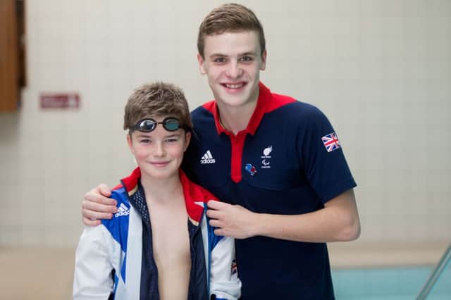 Paralympian swimmer Jack Bridge pictured Coleraine youngster, Charlie ONeill.