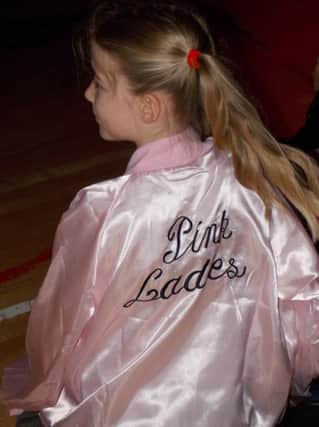 One of the 'Pink Ladies' from our Primary 6/7 production of Grease. INBM52-13