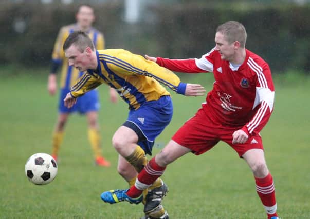Action from Woodlands' draw with Carnmoney.