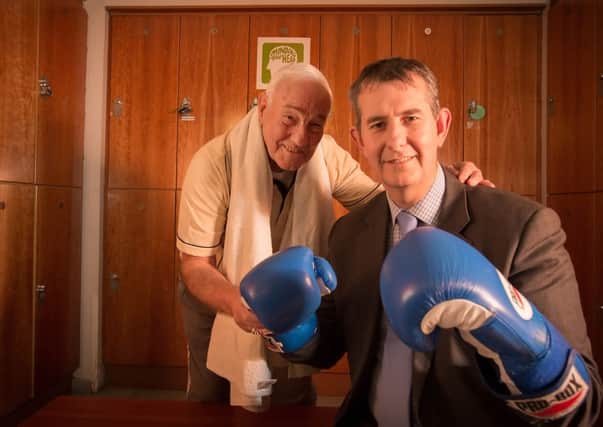 In your corner: legendary boxing trainer Gerry Storey joins Health Minister Edwin Poots to launch the Public Health Agency's new mental health campaign. With almost one in five of us showing signs of a possible mental health problem, the Public Health Agency is urging people to talk about their feelings as the first step to recovery. More information is available at www.mindingyourhead.info