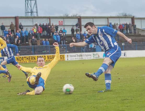Eoin Bradley gets his shot away for Coleraine against Dungannon Swifts.