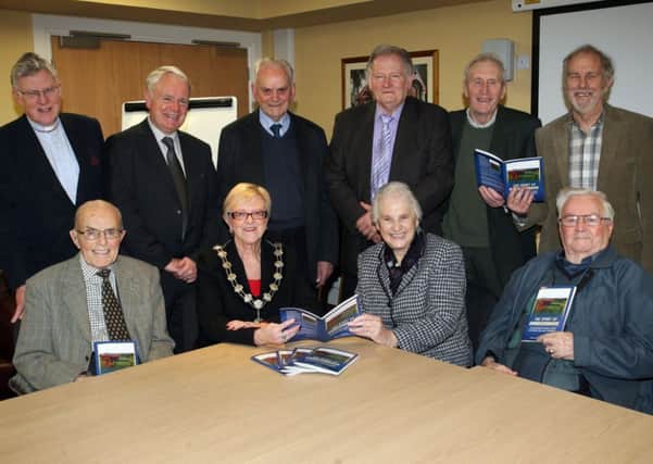 Mayor of Ballymena, Cllr. Audrey Wales is pictured at the launch of the book "Spirit of Broughshane" along with (back row from left) Dean Bond, Lexie Scott (Chairman Broughshane Community Association), Frank Murphy, Wilfie Ramsey, James McIntyre and Ian Hall (Broughshane Community Association). Seated from left: Joseph McClintock, Cllr. Wales, Rene Houston and Billy McKelvey. INBT52-220AC