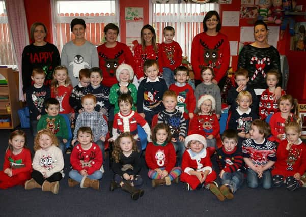 Staff and children from Taylorstown Community Playgroup who wore Christmas jumpers to raise money for Save The Children. INBT51-219AC