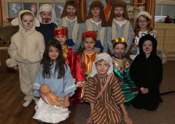 Ballymena Primary School Foundation and Key Stage 1 pupils who performed in the school's P3 Nativity play. Included is Stephanie who played Mary and Sam who played Joseph. INBT 52-100JC