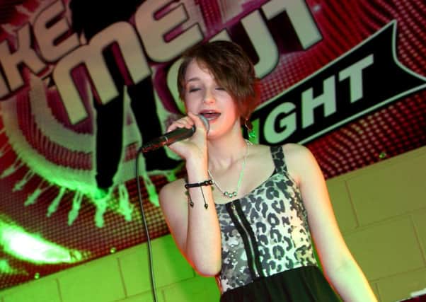 Local singer Amy Gardiner, performing on stage at a Take Me out event in the Newbuildings Community Centre last year. In January of this year, Amanda Holden and Alesha Dixon said they were fans.