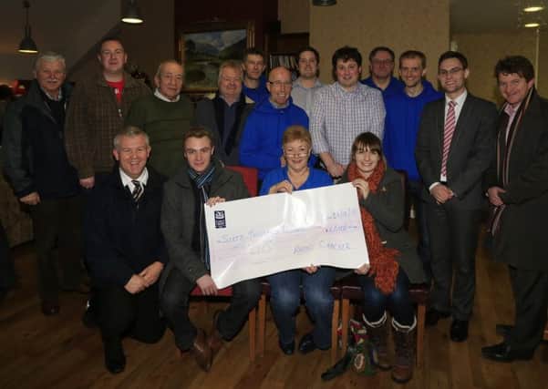 Radio Cracker treasurer Maureen Allen with a cheque for £60,000 which was the final total in the station's fundrasing effort this year. Included is chairman Gordon Dawson, station volunteers plus Richard and Mark Montgomery of Montgomery's Restaurant who once again hosted the station. INBT 53-102JC