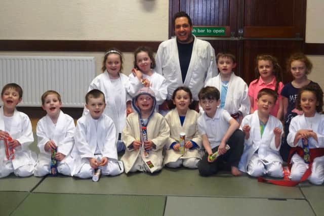 Mark Donald and Junior club members of Sonkei Judo in Ballycastle. inbm01-14