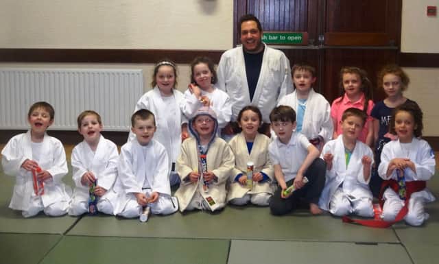 Mark Donald and Junior club members of Sonkei Judo in Ballycastle. inbm01-14