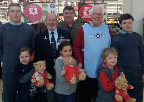 Three Red Arrows teddy bear winners receive their prize from RAFA members.  INCT 01-737-CON