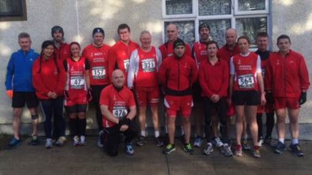 Sperrin Harriers pose for a photo before taking part in the Greencastle 5k.