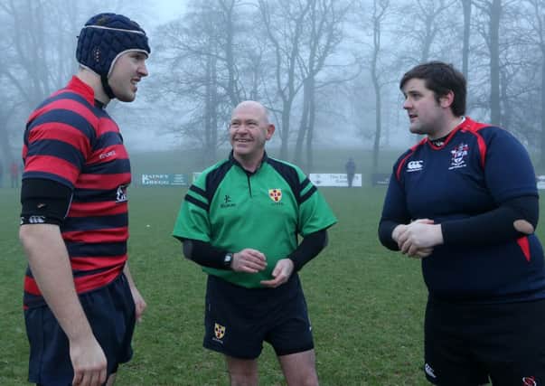 Under 30s captain Michael Shannon and Over 30s captain Richard Montgomery with match referee Steven Hanna before the annual Old Pupils rugby match at Ballymena Academy. INBT 53-172CS