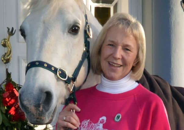 Julie Jordan, who has been awarded an MBE in the New Year Honours, pictured with her pony, Frostie. INLM01-204.