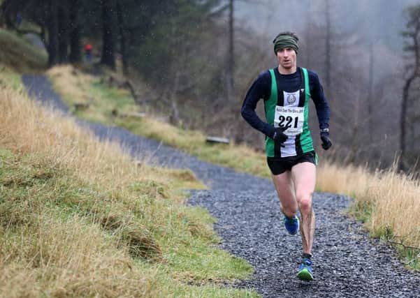 Jarlath Falls of Ballymena & Antrim on his way to winning back his Race Over the Glens title at Glenariffe Forest Park on New Year's Day. INBT 01-170CS