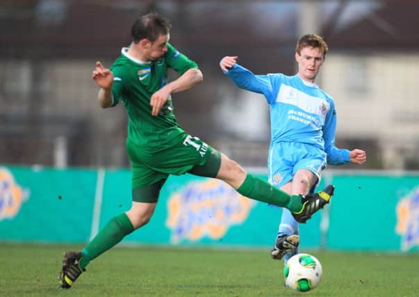 Ballymena's Aaron Stewart clears his lines despite the attentions of Ballinamallard's Stephen Sheridan



 

during today's Danske Bank Premiership match at the Showgrounds. Picture: Press Eye.