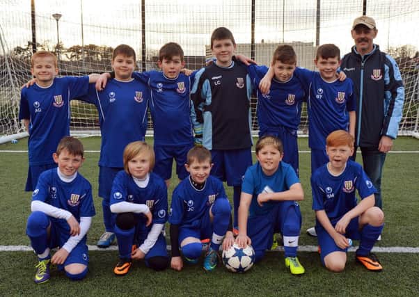 Ballymena Town who played Carniny U-11 on Saturday. Included is coach William Douglas. INBT02-237AC