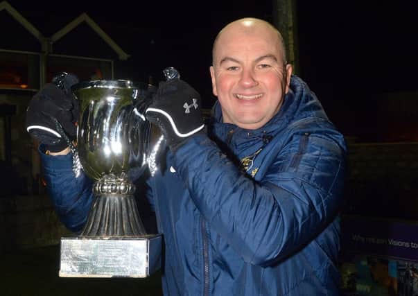 Dollingstown FC manager, Gary Duke, pictured with the Premier Cup after his side beat Camlough Rovers in the final at Holm Park, Armagh, last Friday night. INLM02-203.