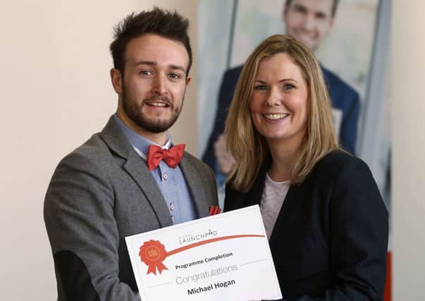 Student Michael Hogan from Newtownabbey receives his certificate of congratulations for making the final of the 'Business Launchpad' programme.