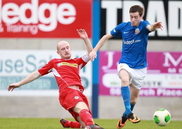 Glenavon's  Andy McGrory skips past Cliftonville's Ryan Catney during the last time the Reds came to Mournview when McGrory scored the winning goal.
