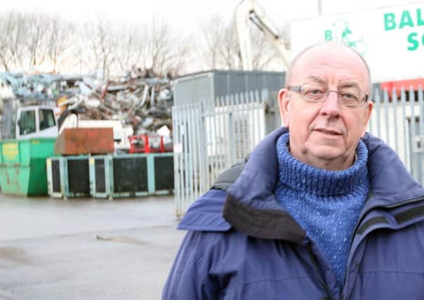Richard Gregory pictured outside one of the scrap metal recycling businesses which have set up in the Mallusk area.