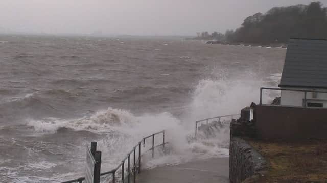 Waves batter the coastal path at Whiteabbey on Sunday afternoon. INNT 02-500CON
