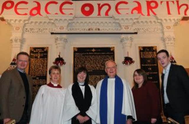 At a Watchnight Service in St Johns Parish Church, Moira on New
Years Eve are L to R: Kevin Paterson (Peoples Warden), Irene
Cunningham (Organist), Rev Joanne Megarrell (Rector), Bertie Logan
(Diocesan Lay Reader), Emma Fleming and Iain McAleavey.
