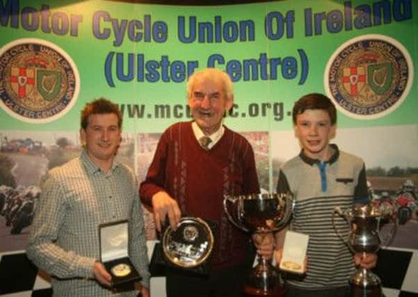 Richard Kerr (right) getting his two medals for the Irish and Ulster titles which he won in 2013. Also pictured Bob Wylie, 2013 sponsor and Christain Elkin, (left), team-mate and former British Champion.