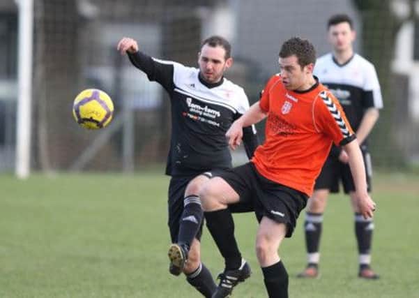 Action from the game between First Lisburn and South Antrim. US1402-547cd