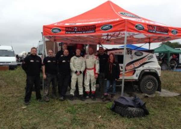 Members of the Race2Recovery team prepare for their race in Dakar Rally.