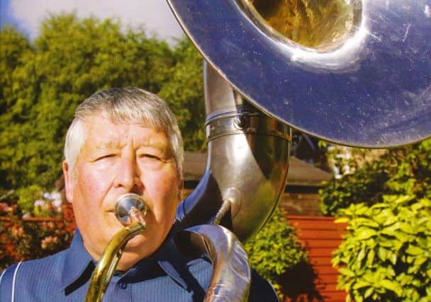 Ken Goodman with a sousaphone.