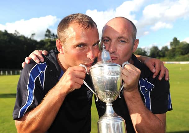 Gordon Cooke pictured with his brother David following last season's Ulster Cup victory over Waringstown.  Presseye/Declan Roughan