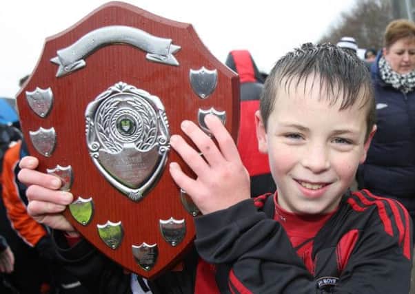 Hillsborough Boys captain Sam Millar holds up the trophy after his side beat Portadown 1-0 in the under-13 Lisburn Junior Invitational League finals.
 US1402-501cd Pic: Cliff Donaldson